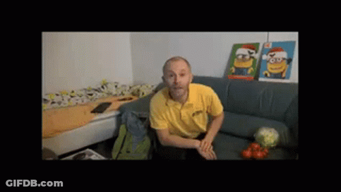 Man In Yellow Shirt On Couch With Two Minion Pictures GIF