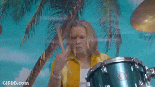 Man In Yellow Shirt Playing Drums In Front Of Palm Trees GIF