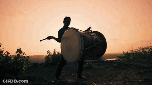 Man In Yellow Shirt Playing Drums With LC Cymbal GIF