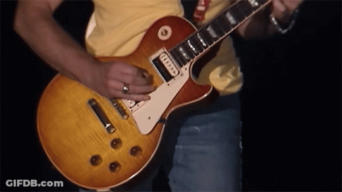 Man In Yellow Shirt Playing Guitar With Fender Sticker GIF