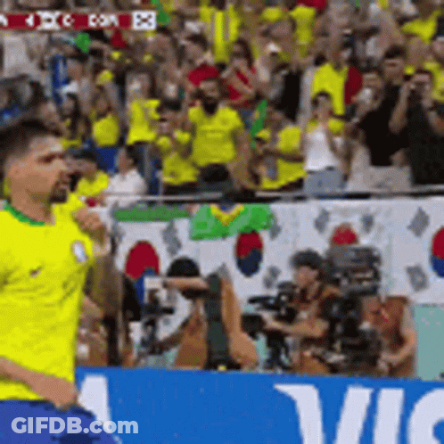 Man In Yellow Shirt Running Past Vic Sign GIF