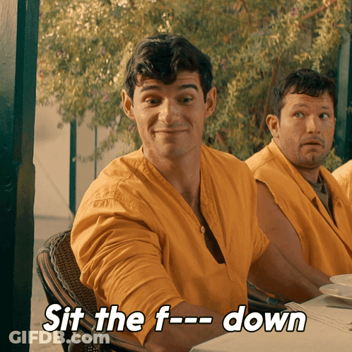 Man In Yellow Shirt Saying Sit Down GIF