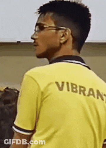 Man In Yellow Shirt Saying Vibrant GIF