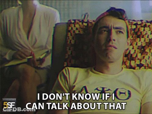 Man In Yellow Shirt Says I Don't Know If I Can Talk About That GIF