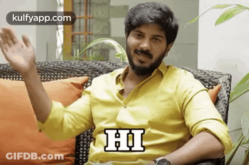 Man In Yellow Shirt Sitting GIF