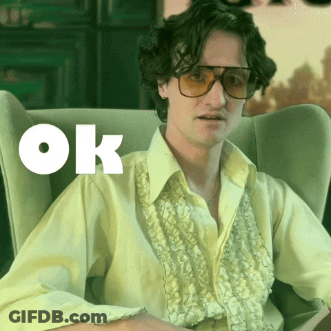 Man In Yellow Shirt Sitting OK GIF
