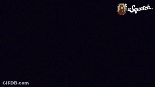 Man In Yellow Shirt Standing In Front Of Red And Blue Wall GIF