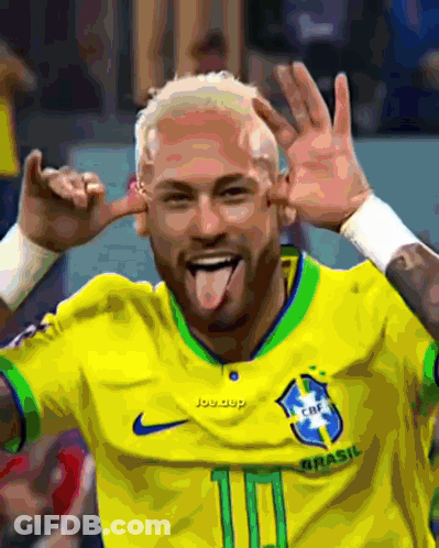 Man In Yellow Shirt Sticking Tongue Out GIF
