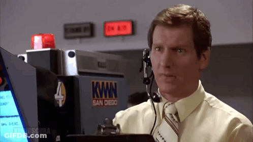 Man In Yellow Shirt Talking Into Headset At Kwan San Diego Sign GIF
