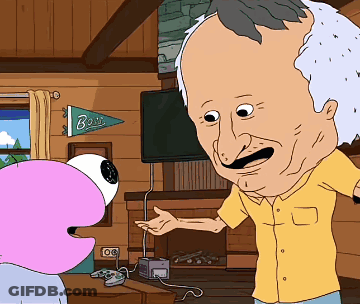 Man In Yellow Shirt Talking To Cartoon Character Under Bois Banner GIF