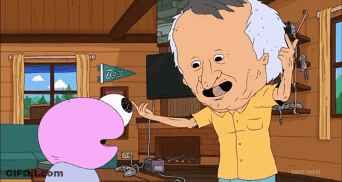 Man In Yellow Shirt Talking To Cartoon Character GIF