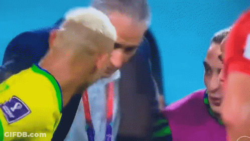 Man In Yellow Shirt Talking To Soccer Player GIF