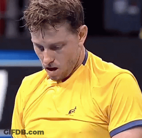 Man In Yellow Shirt With Kangaroo Looking Down GIF