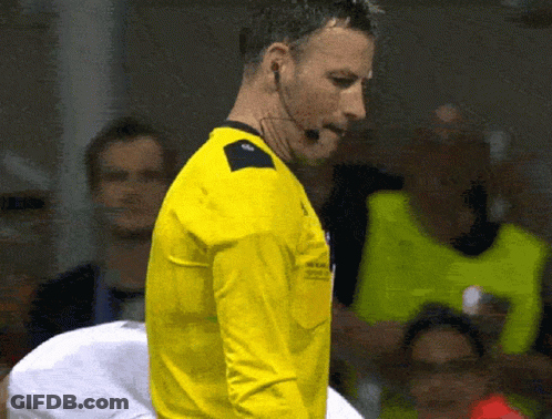 Man In Yellow Shirt With Microphone In Front Of Crowd GIF