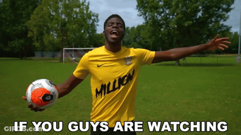 Man In Yellow Shirt With Million Holding Soccer GIF