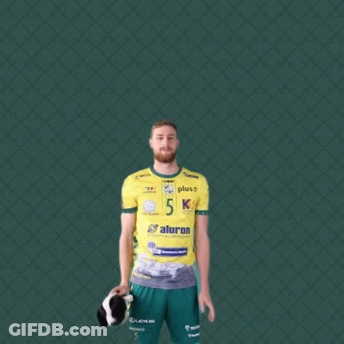 Man In Yellow Shirt With Number 5 Holding Shoes GIF