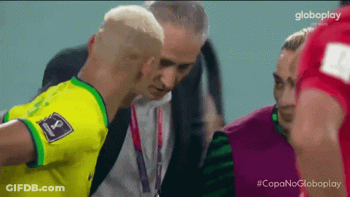 Man In Yellow Shirt With Number 8 Talking GIF