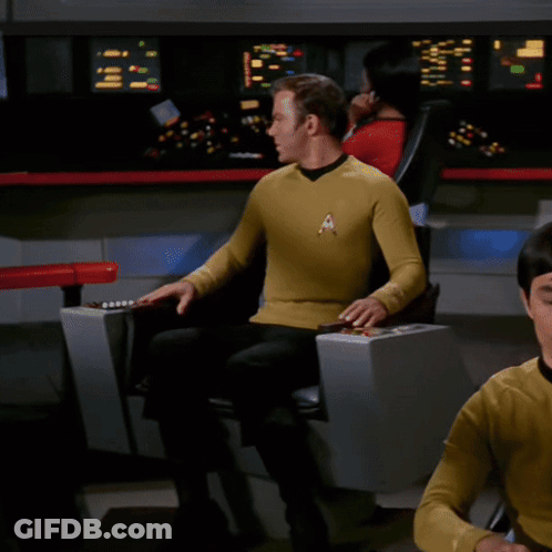 Man In Yellow Shirt With Star Trek Badge GIF