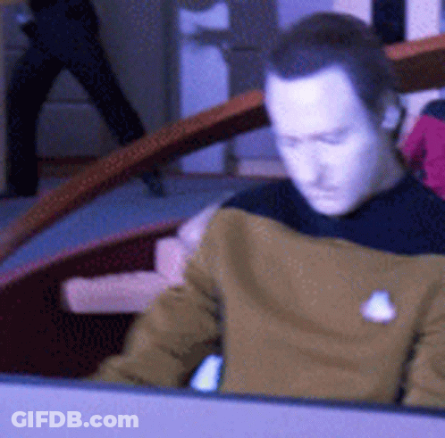 Man In Yellow Shirt With White Badge GIF
