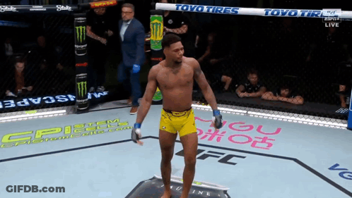Man In Yellow Shorts In Boxing Ring With Toyo Tires GIF