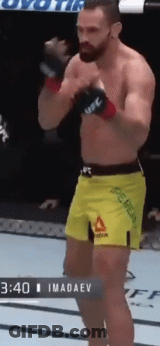 Man In Yellow Shorts Standing In Boxing Ring GIF