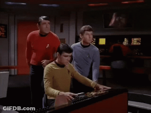 Man In Yellow Star Trek Shirt Using Computer GIF