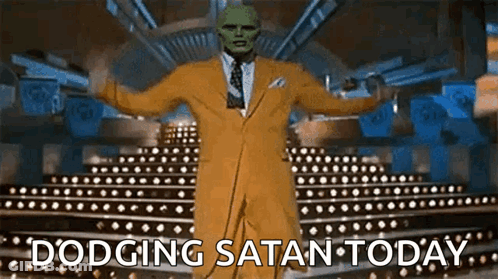 Man In Yellow Suit And Green Mask Dodging Satan Today GIF