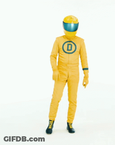 Man In Yellow Suit And Helmet In Front Of Let's Talk Sign GIF