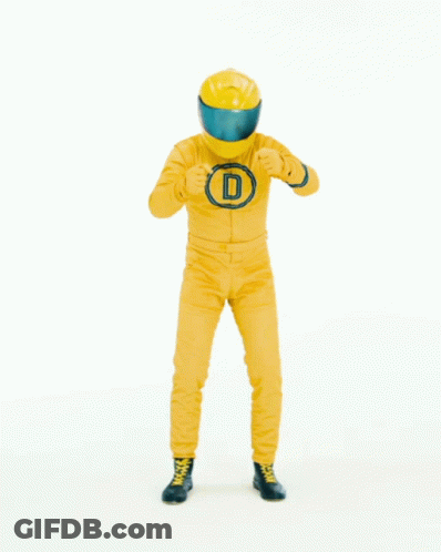 Man In Yellow Suit And Helmet In Front Of Sign Saying Und Abfahrt GIF