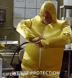 Man In Yellow Suit Holding Hose GIF