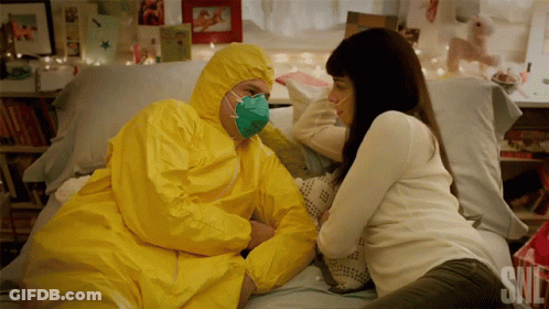Man In Yellow Suit Lying On Bed GIF