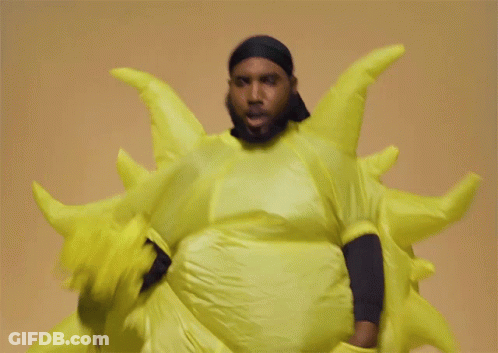 Man In Yellow Sun Costume Smiling GIF
