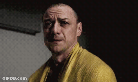 Man In Yellow Sweater And Scarf Making Funny Face GIF