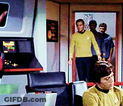 Man In Yellow Sweater Sitting In Chair GIF