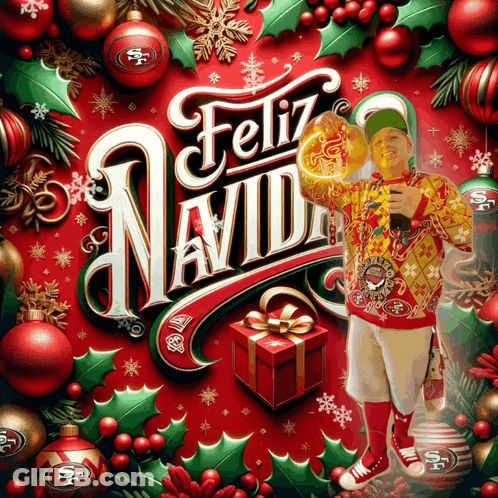 Man In Yellow Sweater With Feliz Navidad Card GIF