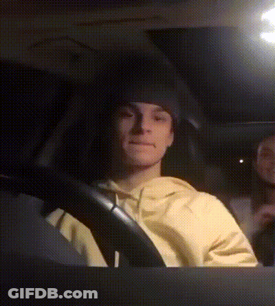 Man In Yellow Sweatshirt Driving Car GIF