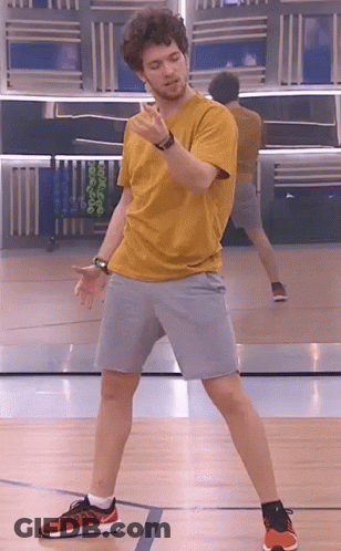 Man In Yellow T-Shirt Dancing On Basketball Court GIF