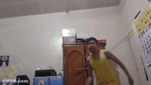 Man In Yellow Tank Top Dancing GIF