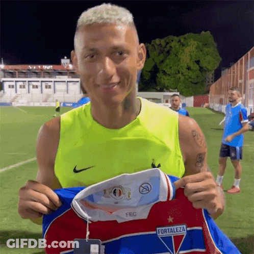 Man In Yellow Tank Top Holding Fortaleza Jersey GIF