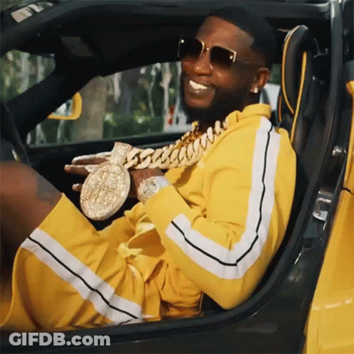 Man In Yellow Tracksuit Sitting In Car GIF