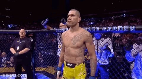 Man In Yellow UFC Shorts In Boxing Cage GIF
