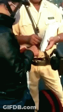 Man In Yellow Uniform Holding Paper GIF