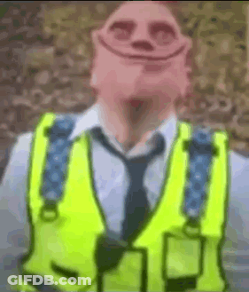 Man In Yellow Vest And Tie With Smiley Face GIF