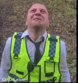 Man In Yellow Vest Looking Up At Sky GIF