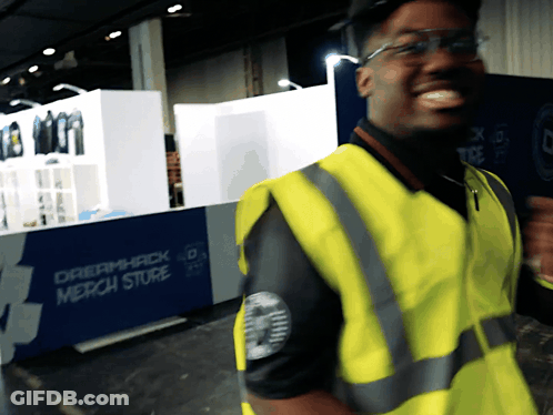 Man In Yellow Vest Smiling At Dreamhack GIF