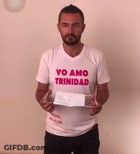 Man In Yo Amo Trinidad Shirt Holding Face Mask GIF