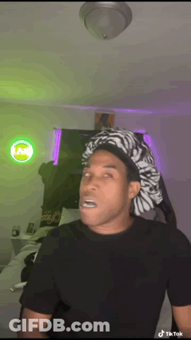 Man In Zebra Hat Making Funny Face GIF