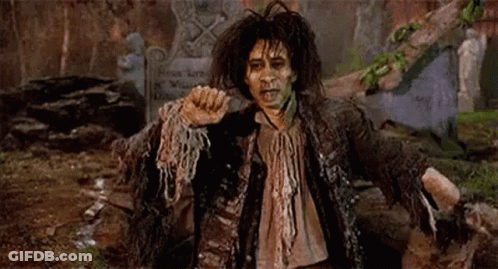 Man In Zombie Costume In Cemetery GIF