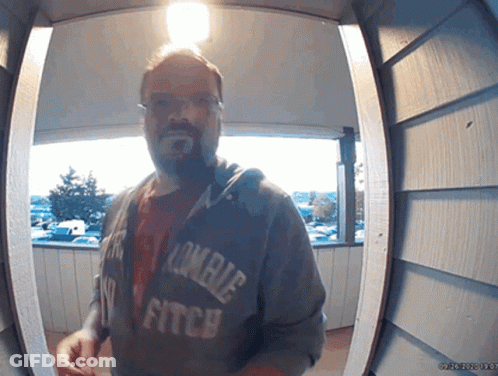 Man In Zombie Fitch Hoodie At Doorway GIF