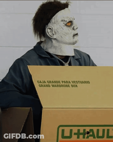 Man In Zombie Mask Holding U-Haul Box GIF